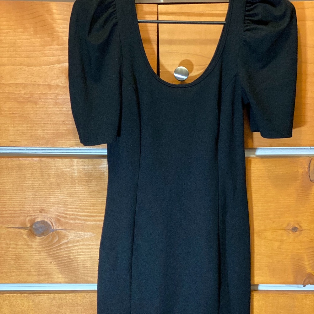 Little black dress with pointed shoulders